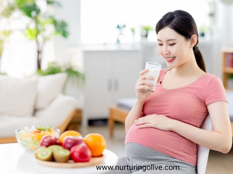 A-pregnant-woman-enjoying-healthy-pregnant-tips-every-woman-needs-with-a-glass-of-milk-and fruits