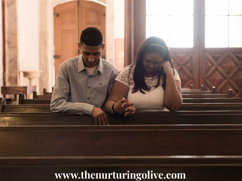 A-couple praying-in-the-church-after-conflict