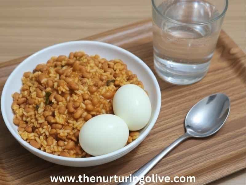 Palm-oil-jollof-rice-and-beans-Served-with-a-glass-of-water