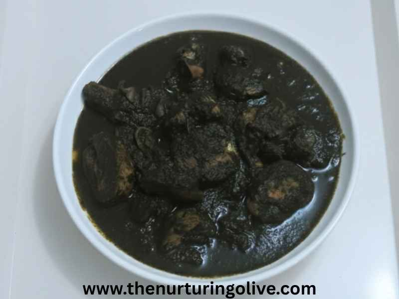 nigerian-healthy-black-soup-edo-state-tradition-black-soup-served-in-a-white-dish-and-white-tray
