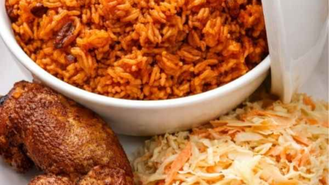 smoky-nigerian-party-jollof-rice-served-with-fried-chicken-and-coleslaw.