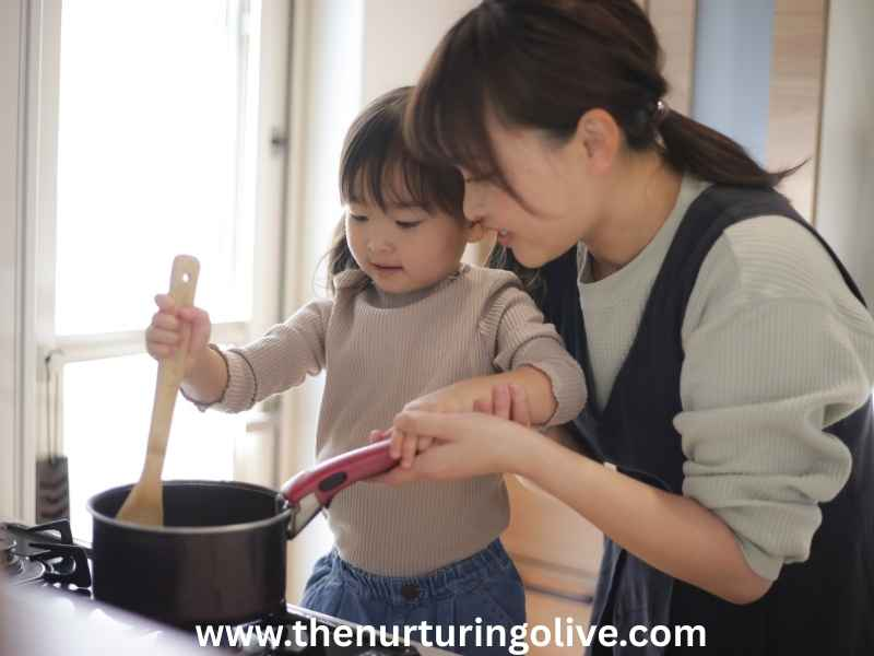 Mother teaching her child to cook in the kitchen as part of old-fashioned parenting and traditional family values.