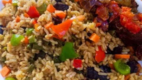 Fresh Nigerian fried rice served on the dining table showing the final result of how to make Nigerian fried rice at home