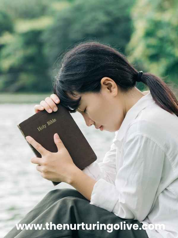Young Christian woman reflecting on biblical advice for dating as a Christian woman while reading her Bible